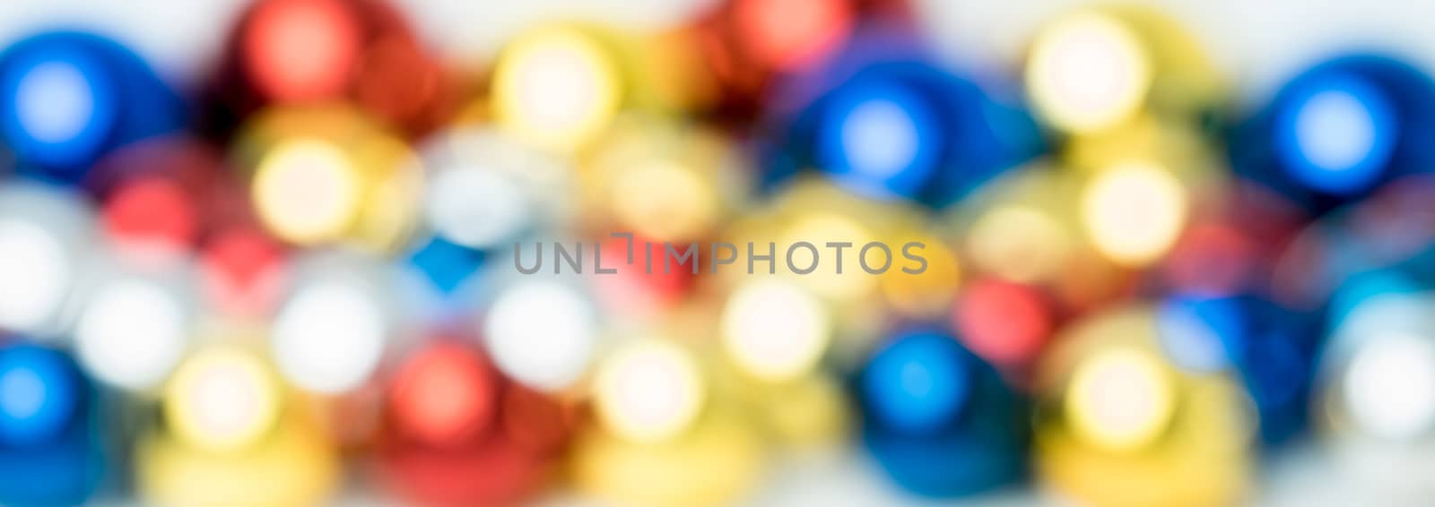 Bokeh abstract background from Christmas ball red, blue, golden