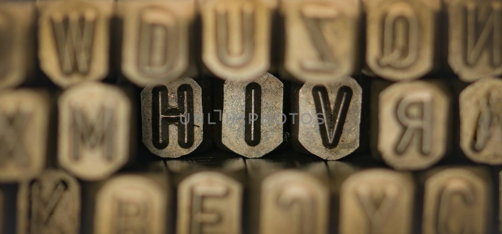 HIV spelled from metal stamp alphabet punch, HIV words stand for The Human Immunodeficiency Virus by Fahroni