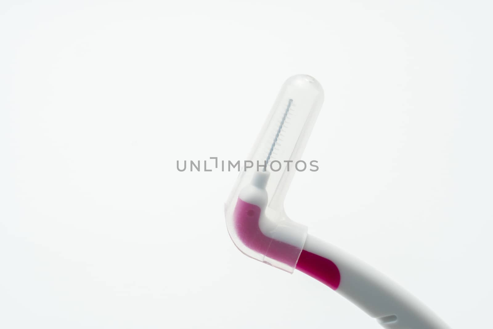 Interdental brush with cover isolated on white background