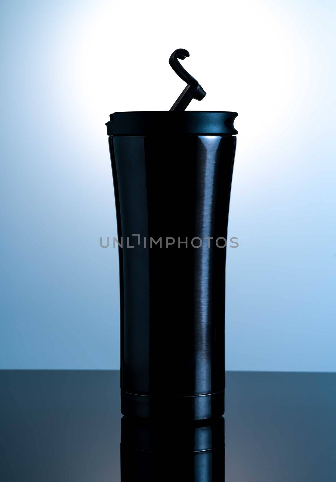 Black thermos bottle with open cap put on black glass with white background by Fahroni