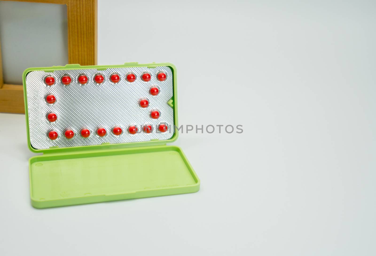 Contraceptive pills on white background. Birth control pill. Pharmaceutical product. Pharmacy background. Family planning. by Fahroni