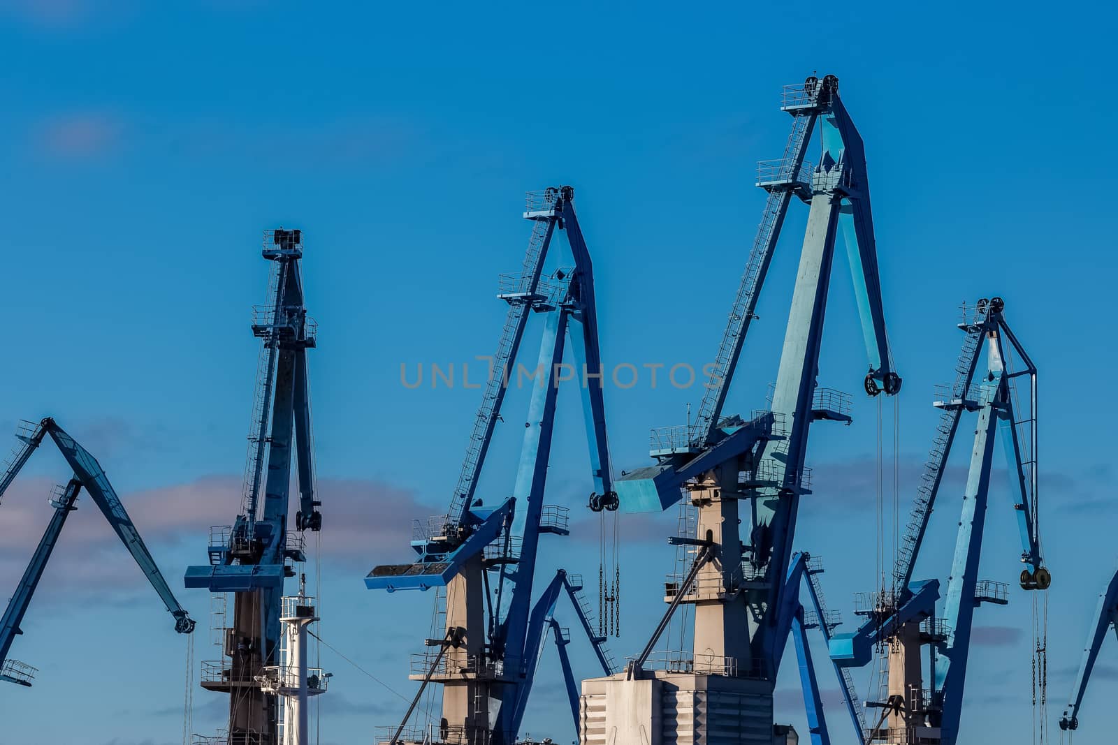 Blue cargo cranes in the port of Riga, Europe