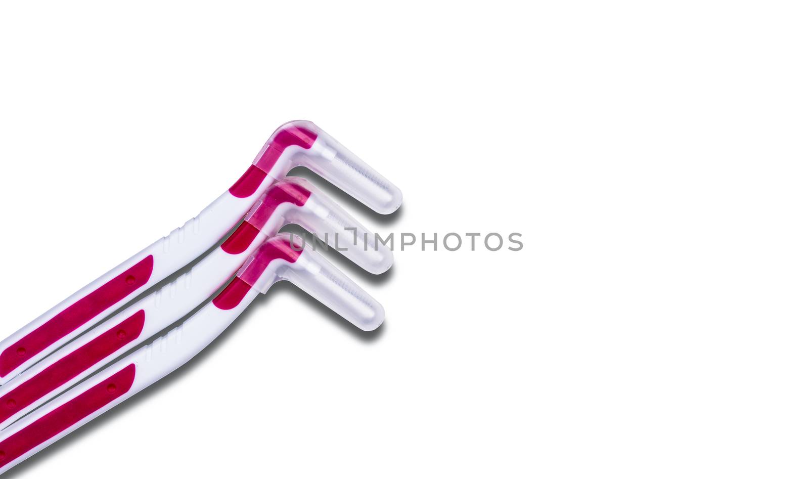 Three interdental brush with cover isolated on white background with copy space for text. Dental care concept. Equipment for get rid of food stuck in teeth by Fahroni