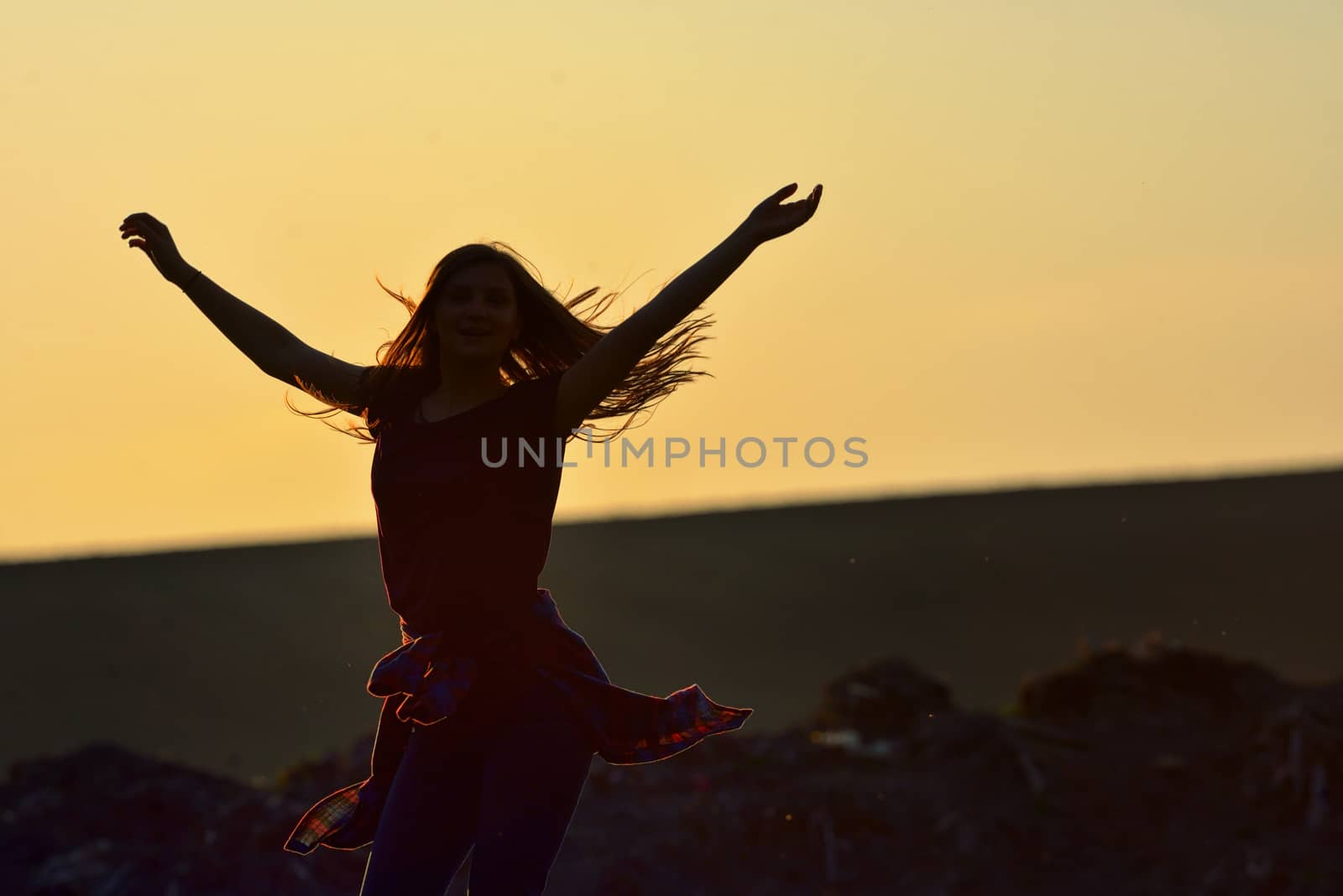 Teen girl jump against beautiful sunset by mady70