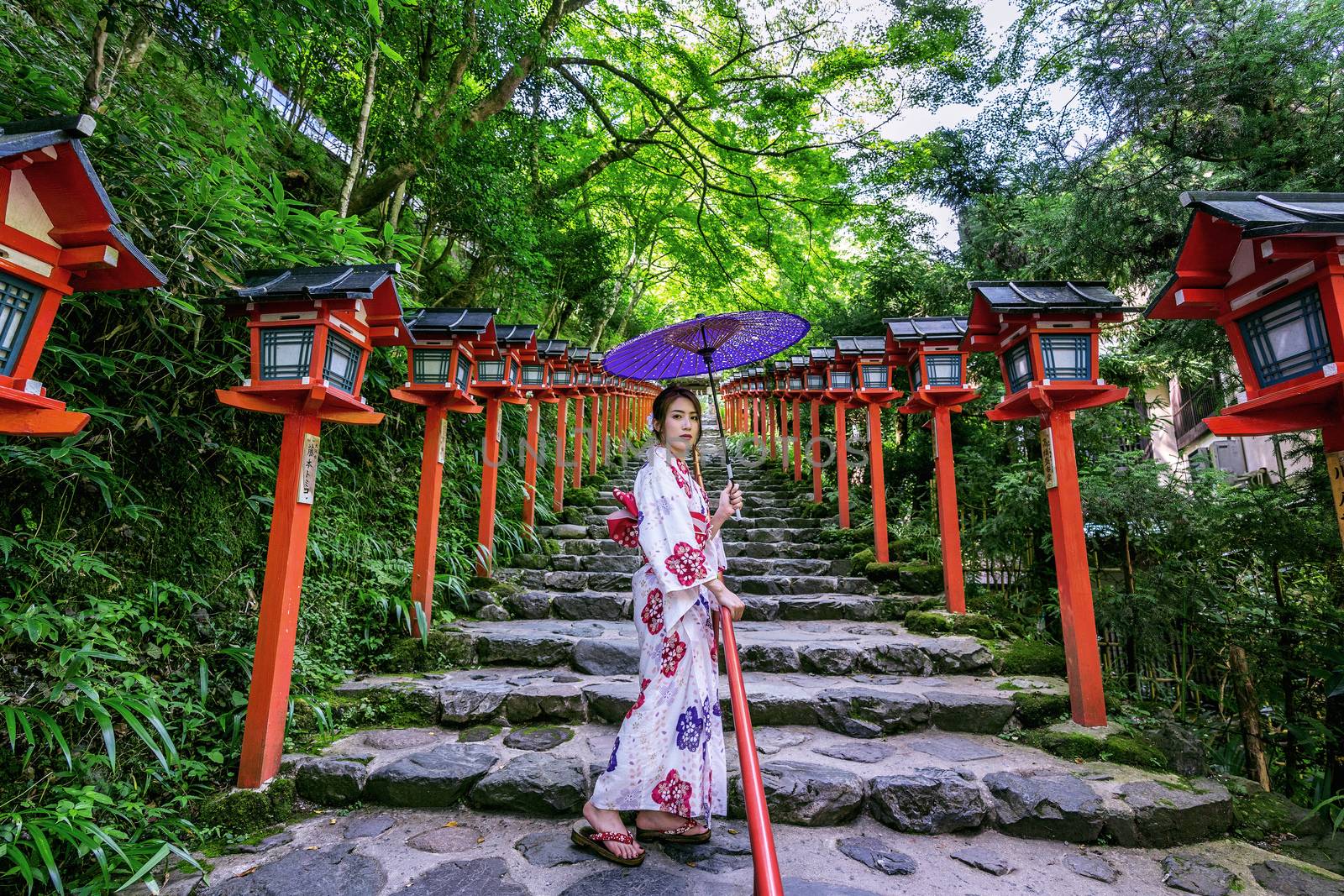 Asian woman wearing japanese traditional kimono at  Kifune Shrine in Kyoto, Japan. by gutarphotoghaphy