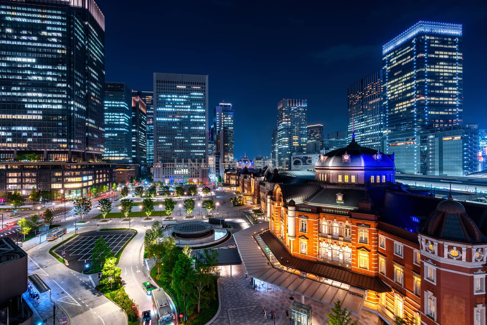 Tokyo railway station and business district building at night, Japan. by gutarphotoghaphy