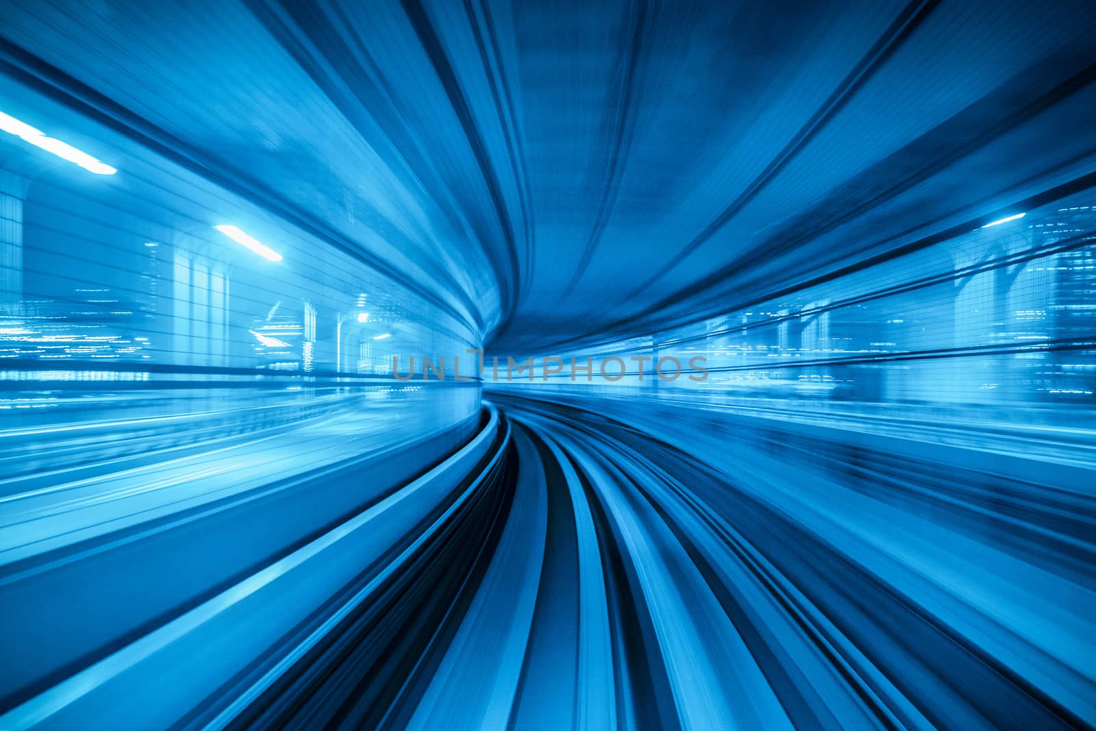 Motion blur of Automatic train moving inside tunnel in Tokyo, Japan. by gutarphotoghaphy