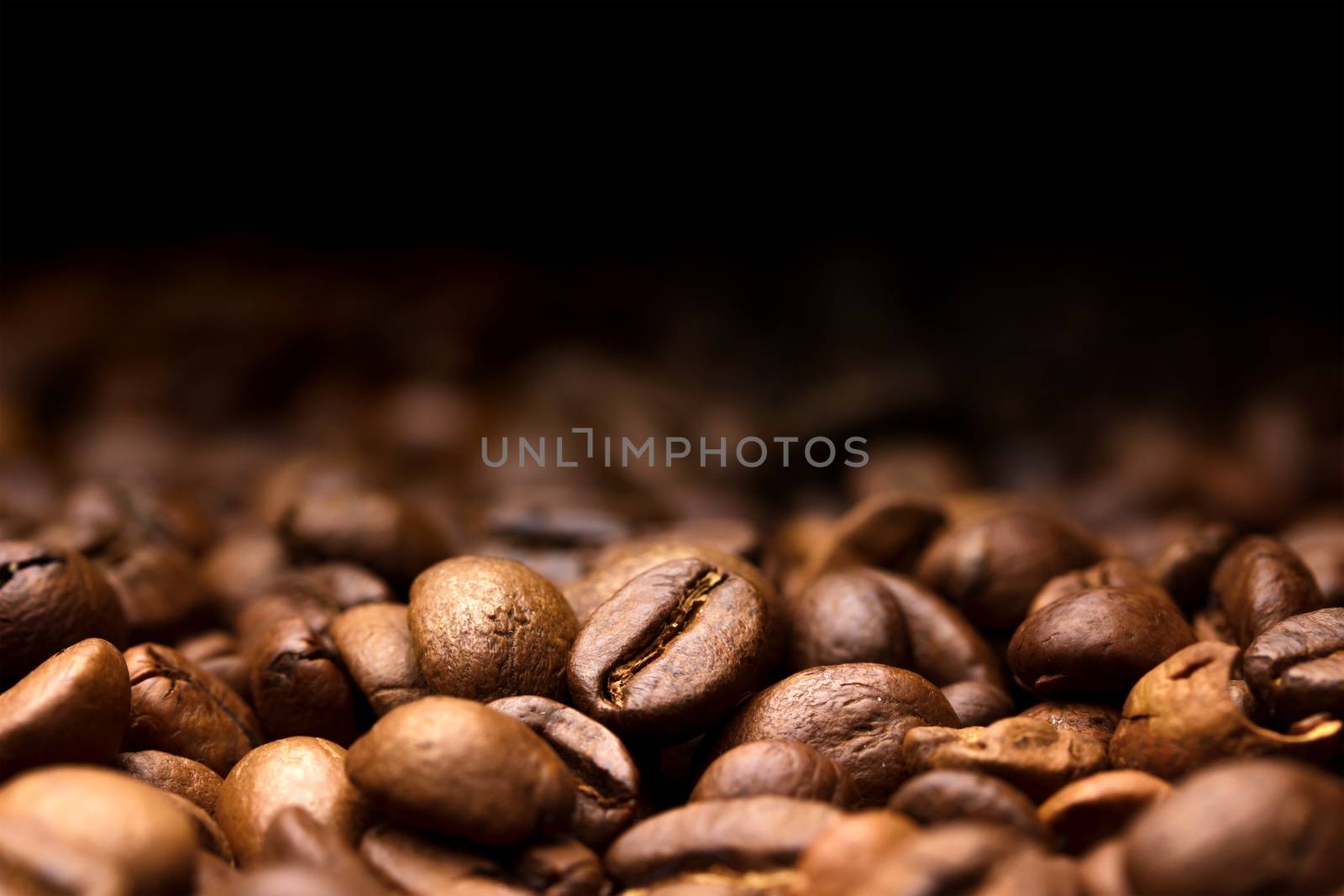 Coffee beans on black background, copy space by xamtiw