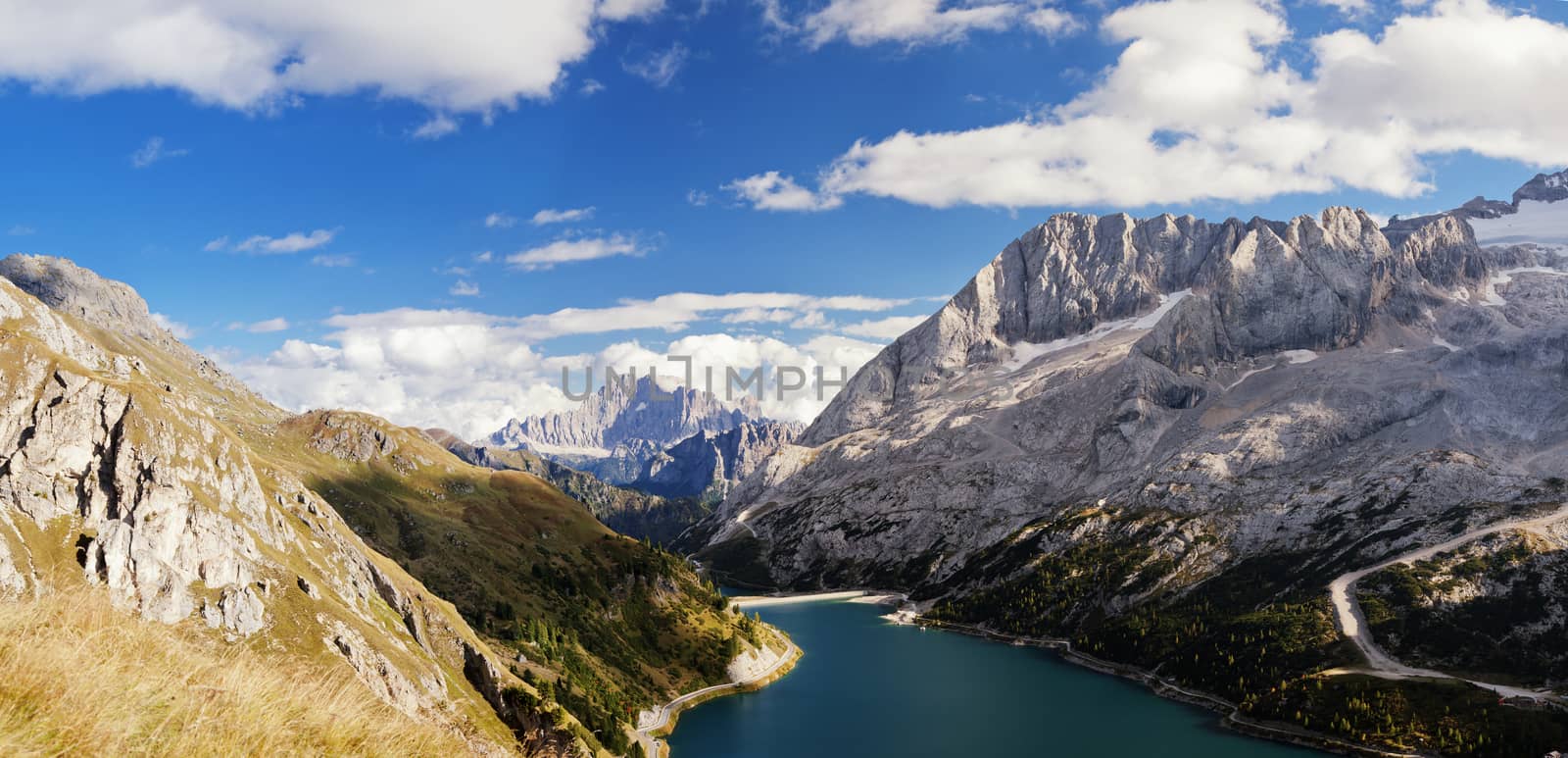 Fedaia lake in Dolomites with view of Marmolada mountain