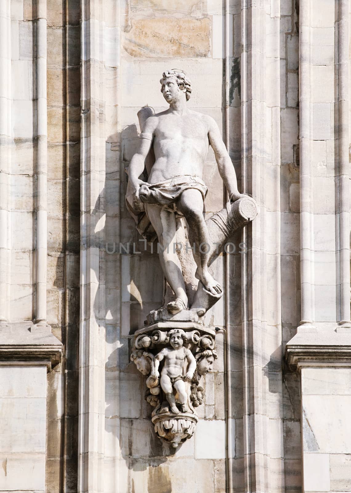 Statue on the wall of cathedral in Milan, Italy