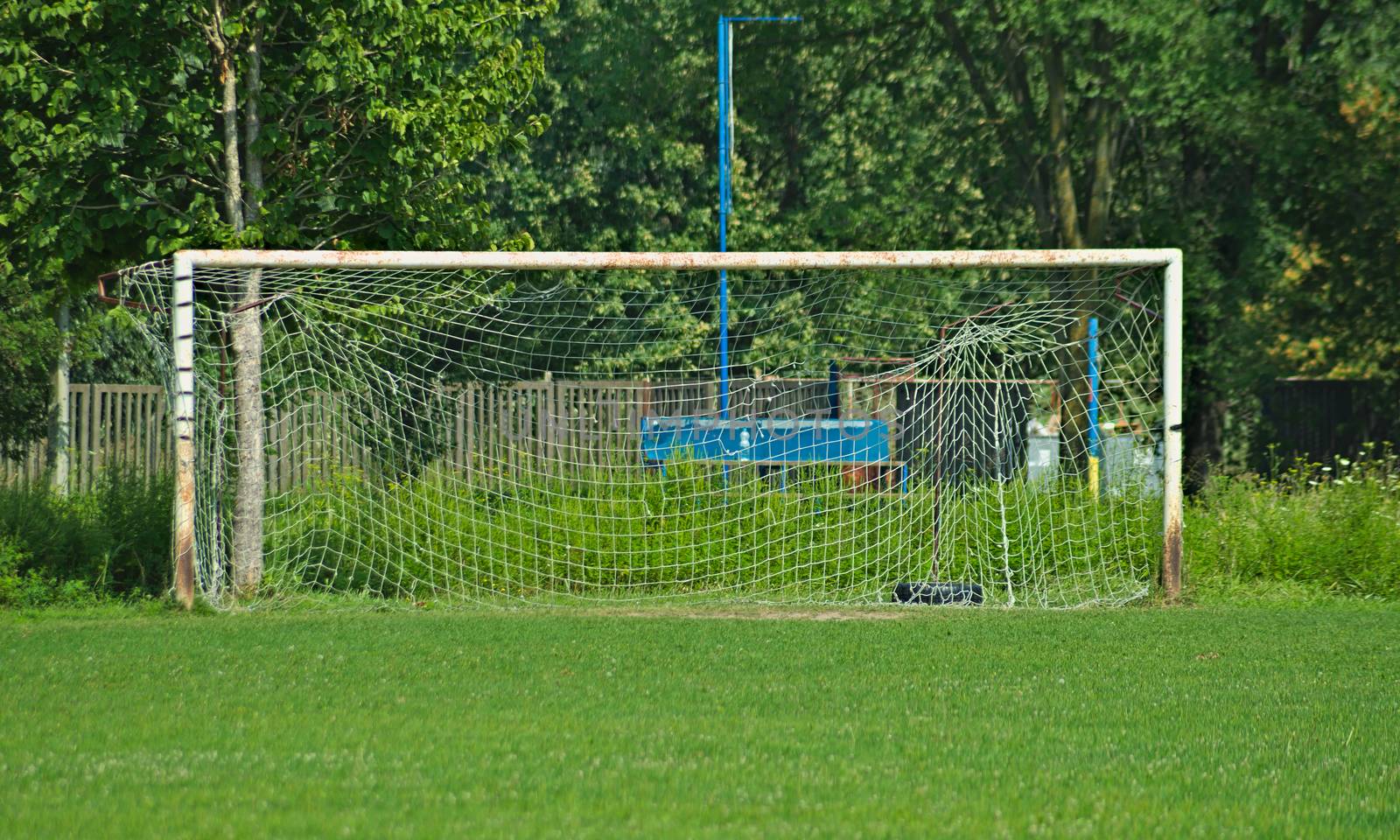 Rustic metal goal gate on football field