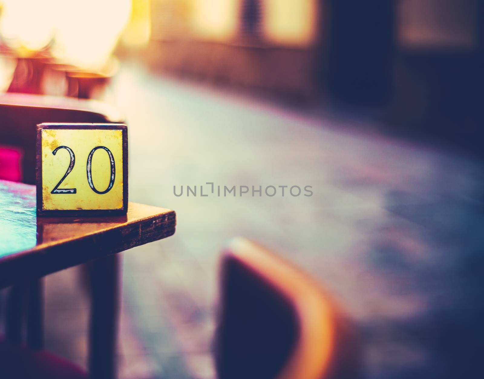 Retro Detail Of A Table Number At A Paris Cafe In An Empty Street At Sunset With Copy Space