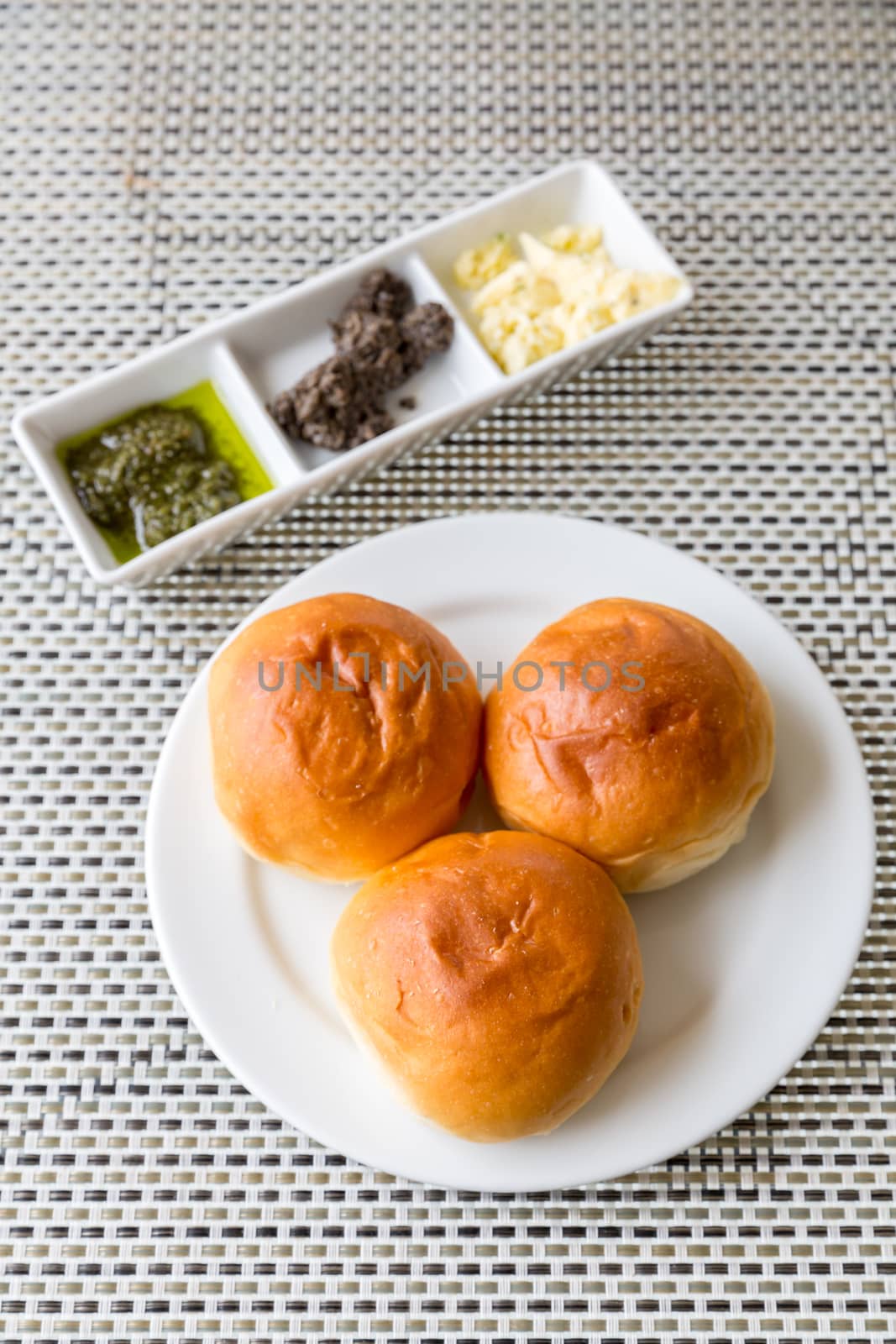 Dinner roll bread Fresh baked with assorted butter in white plate for dinner course