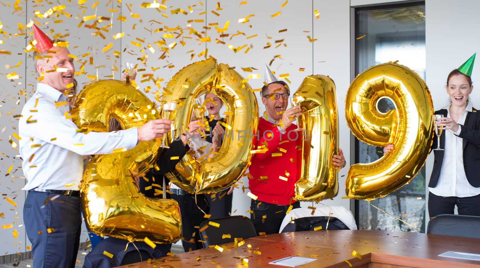 Business people celebrating 2019 New Year at office party