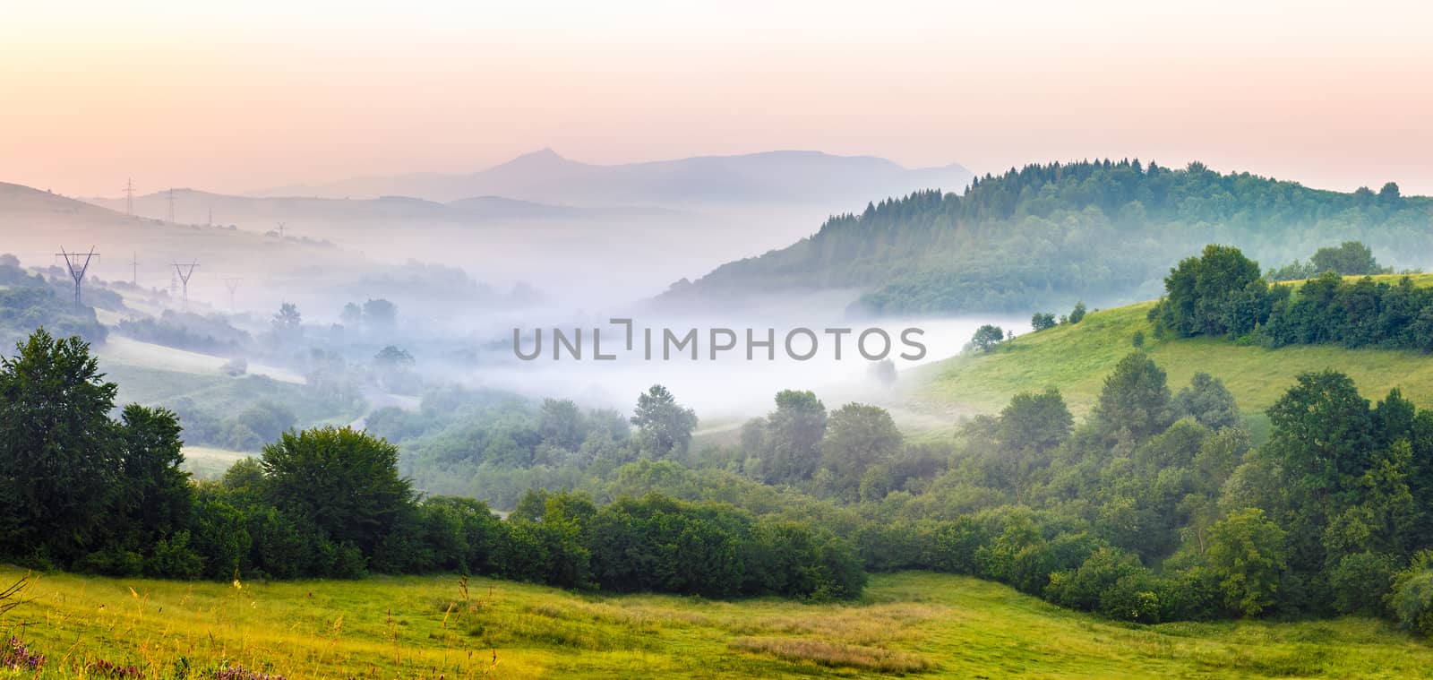 fog on hillside in rural area by Pellinni