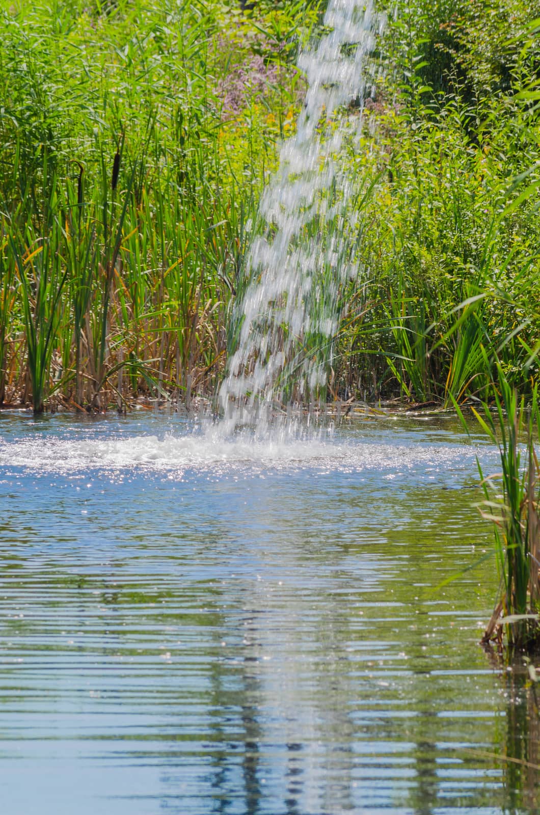 Waterfall from an old rusted iron pipe