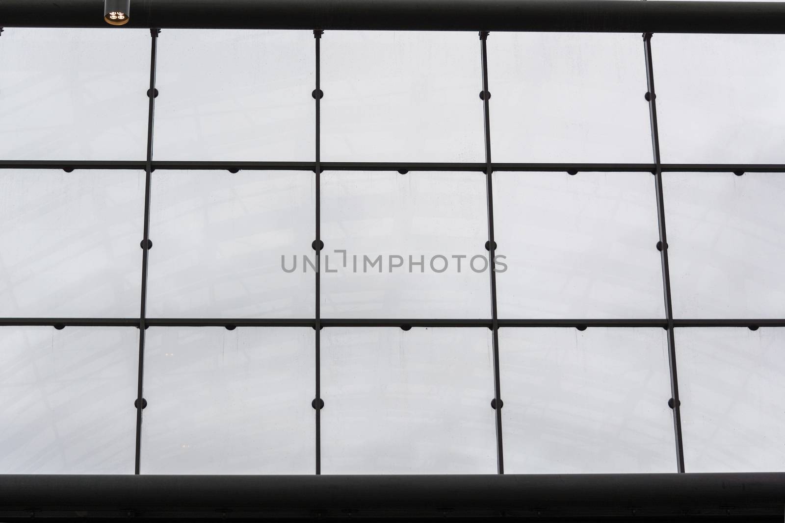 Modern office building with glass facade as a background.