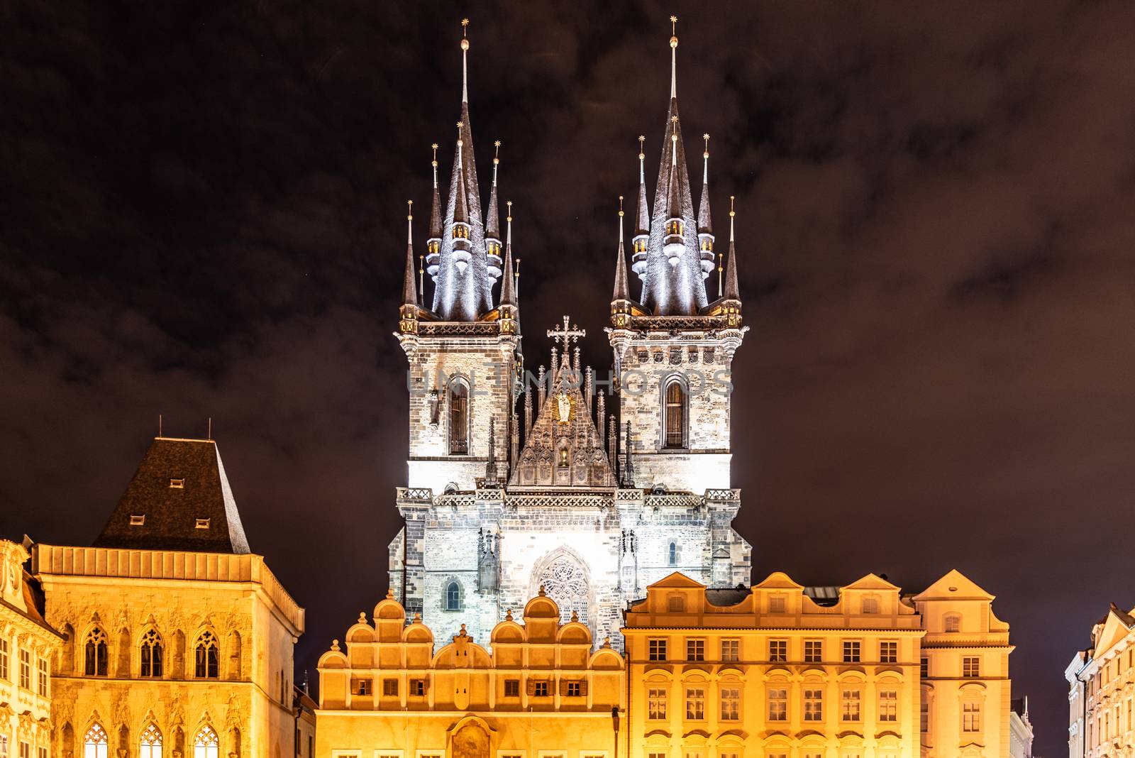 Two gothic towers of Church Of Our Lady Before Tyn at Old Town Square by night. Prague, Czech Republic.
