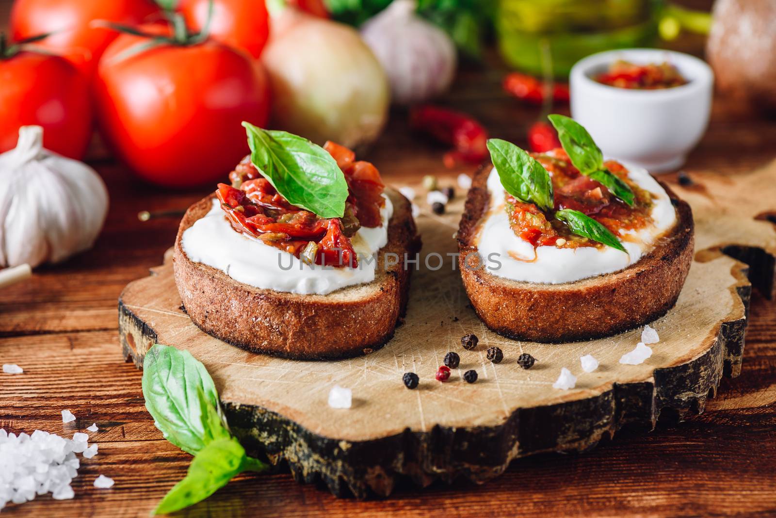 Bruschettas with Dried Tomatoes and Spicy Sauce by Seva_blsv