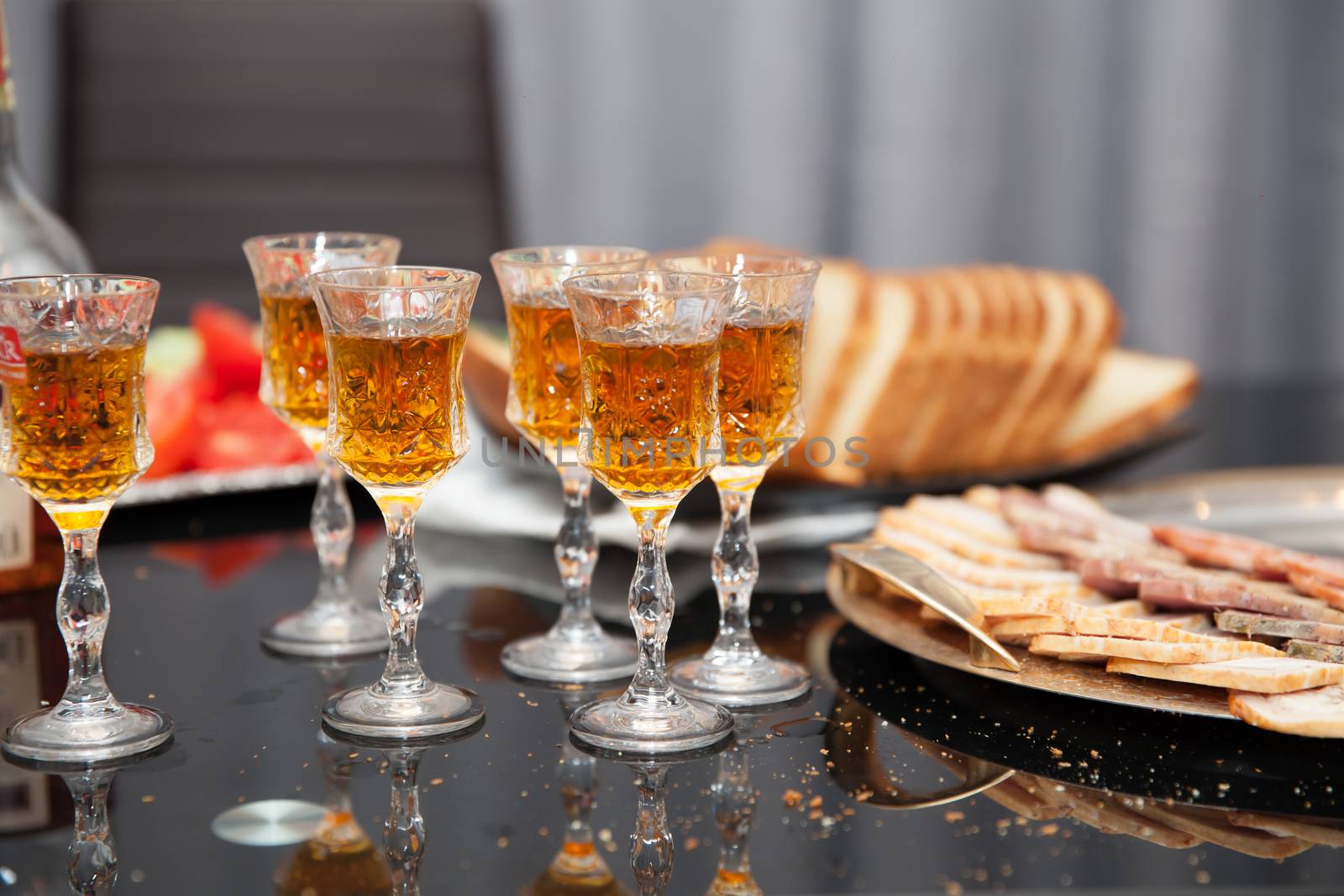 Glasses for cognac and whiskey, arrangen with food on party table
