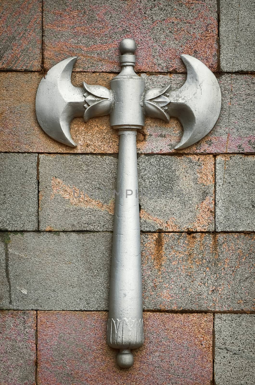 Decorative Element in the Form of an Ax on a Stone Wall