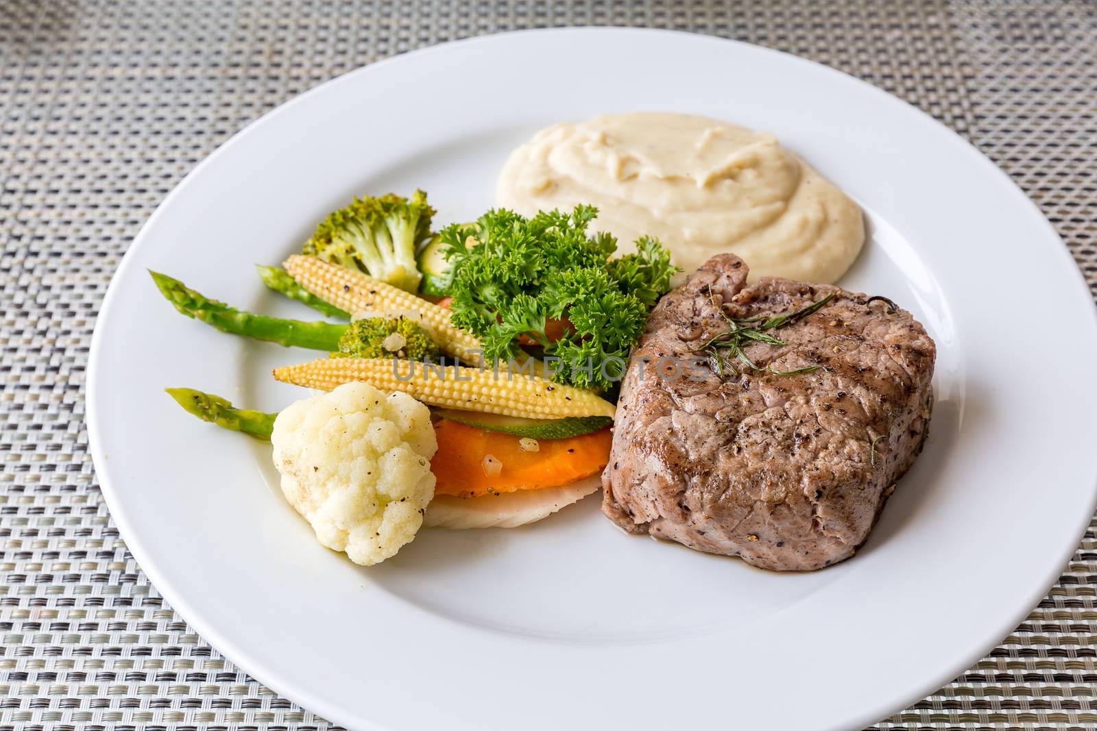 grilled fillet steak served with grilled vegetable and mash potato