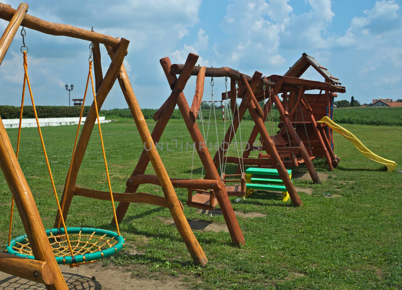 Several children hammocks in a row on a playground by sheriffkule