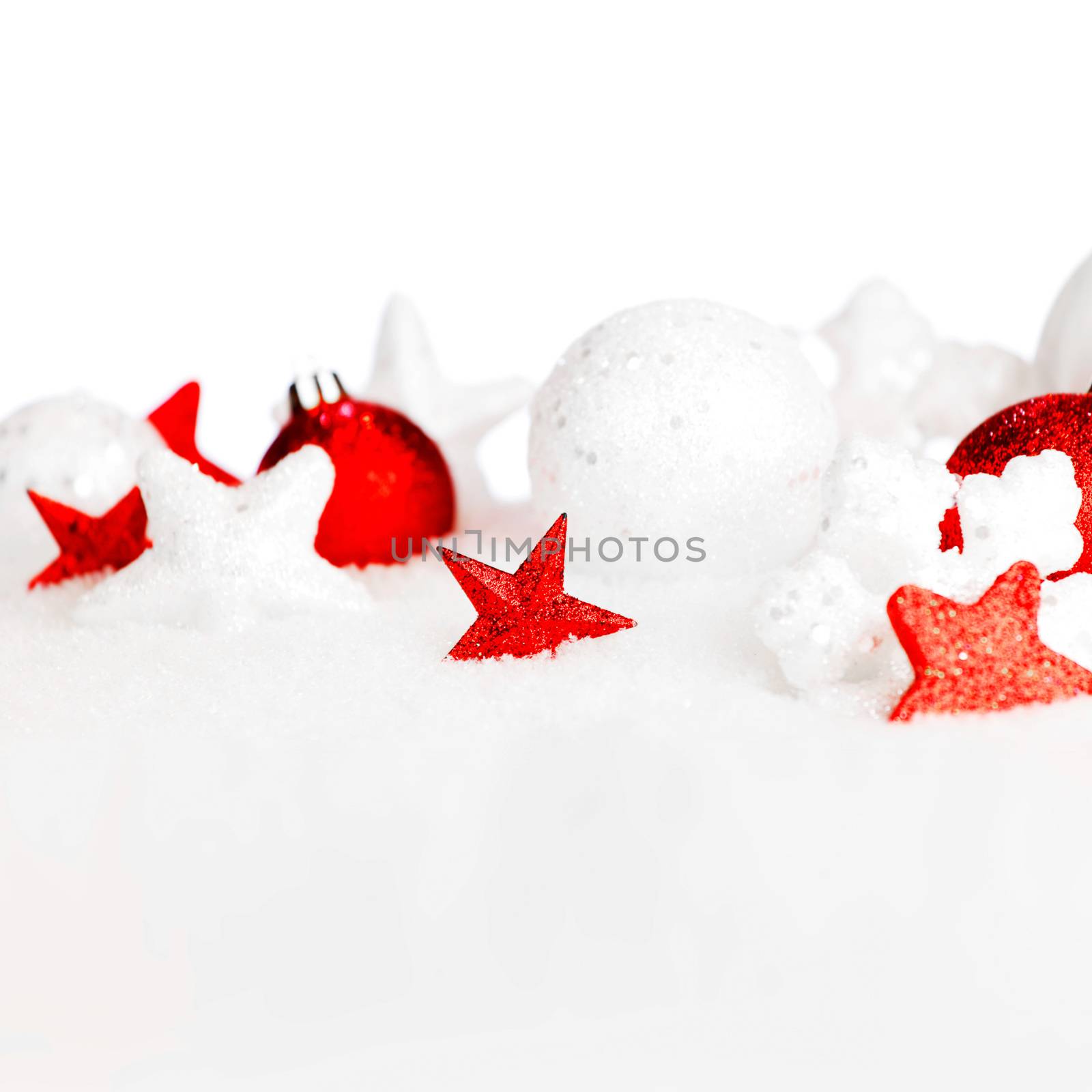 Christmas card with beautiful decorations in snow on white