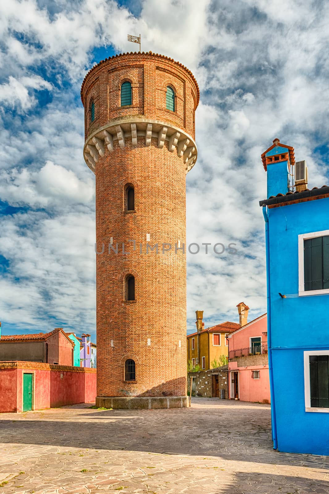 Water tower on the island of Burano, Venice, Italy. The island is a popular attraction for tourists due to its picturesque architecture