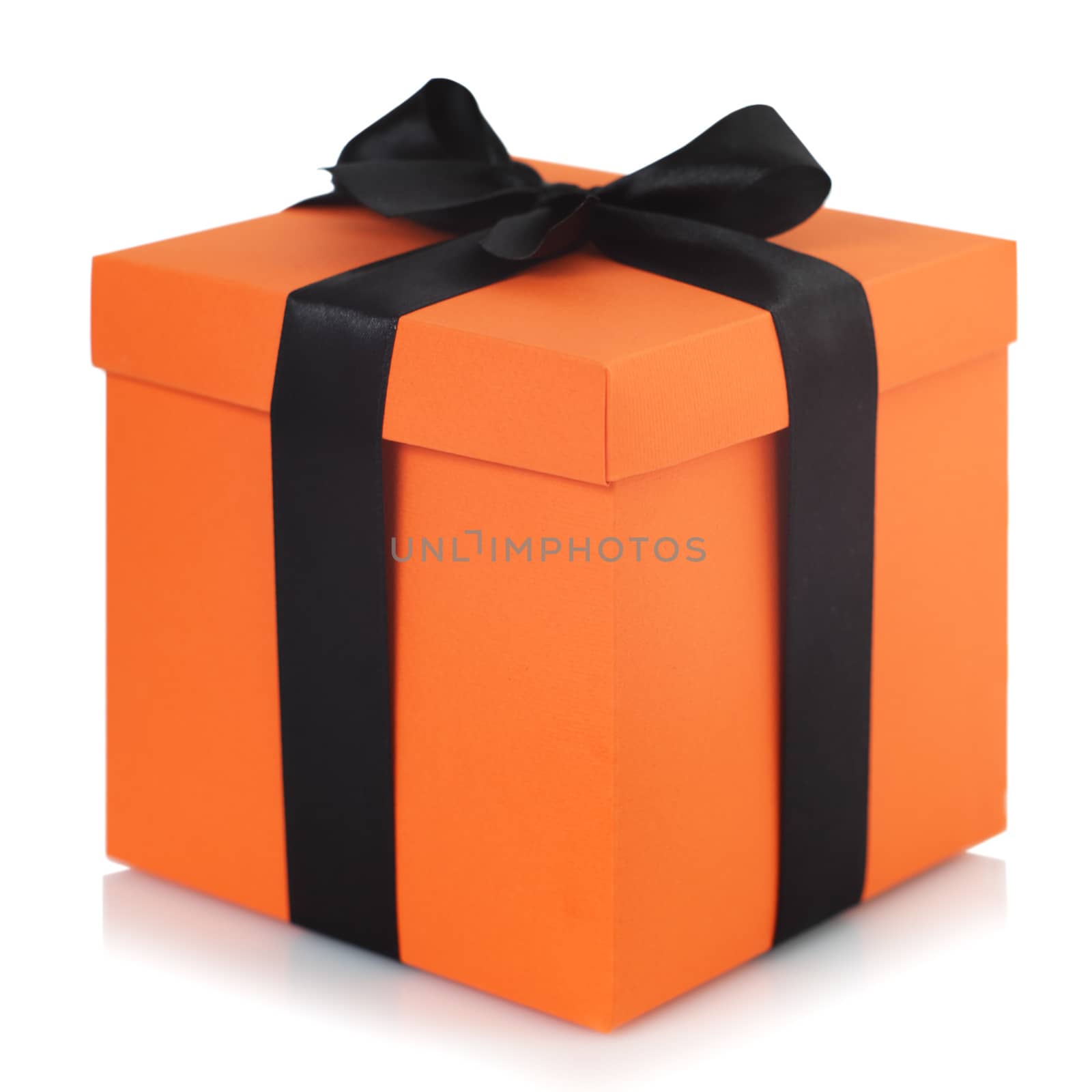 Decorated black and orange halloween gift box isolated on white background with reflection