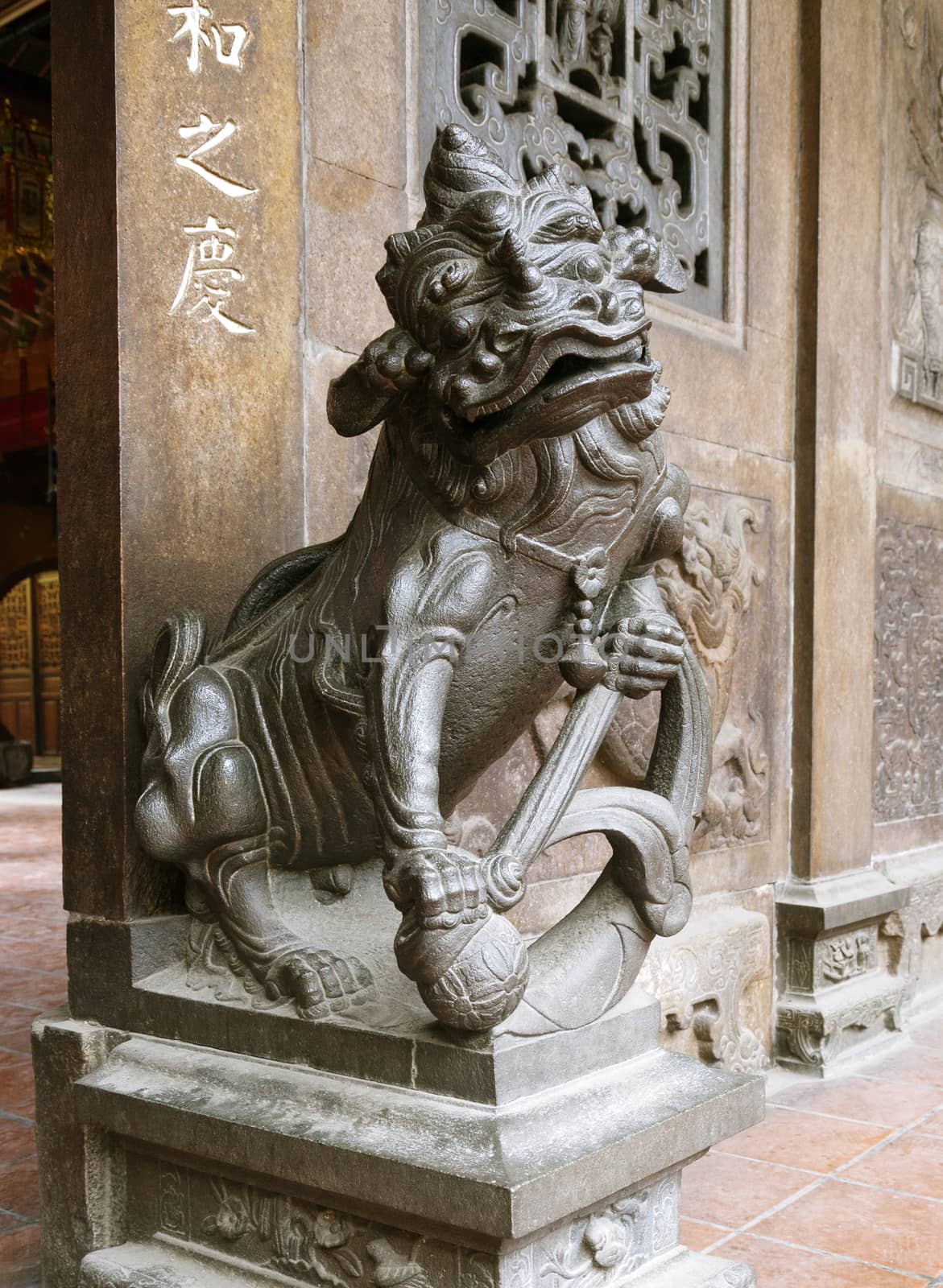 Marble lion at the entrance of a temple, Vietnam