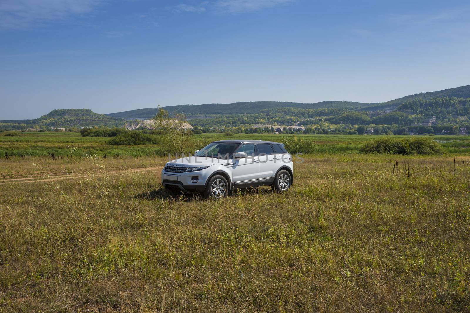 Car Land Rover Range Rover is in the field on a Sunny autumn day near the city of Samara, Russia. August 1, 2018.