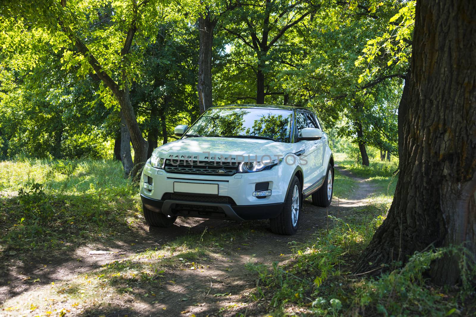 Car Land Rover Range Rover in summer Sunny weather in the summer landscape of the Samara region, Russia. August 21, 2018 by butenkow
