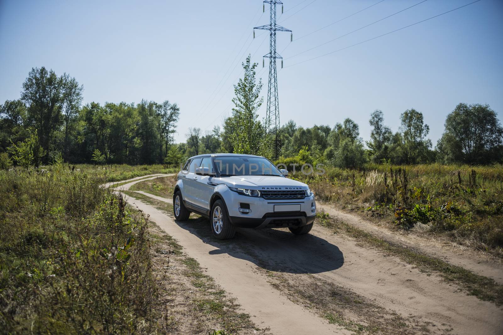 Car Land Rover Range Rover in summer Sunny weather in the summer landscape of the Samara region, Russia. August 21, 2018 by butenkow