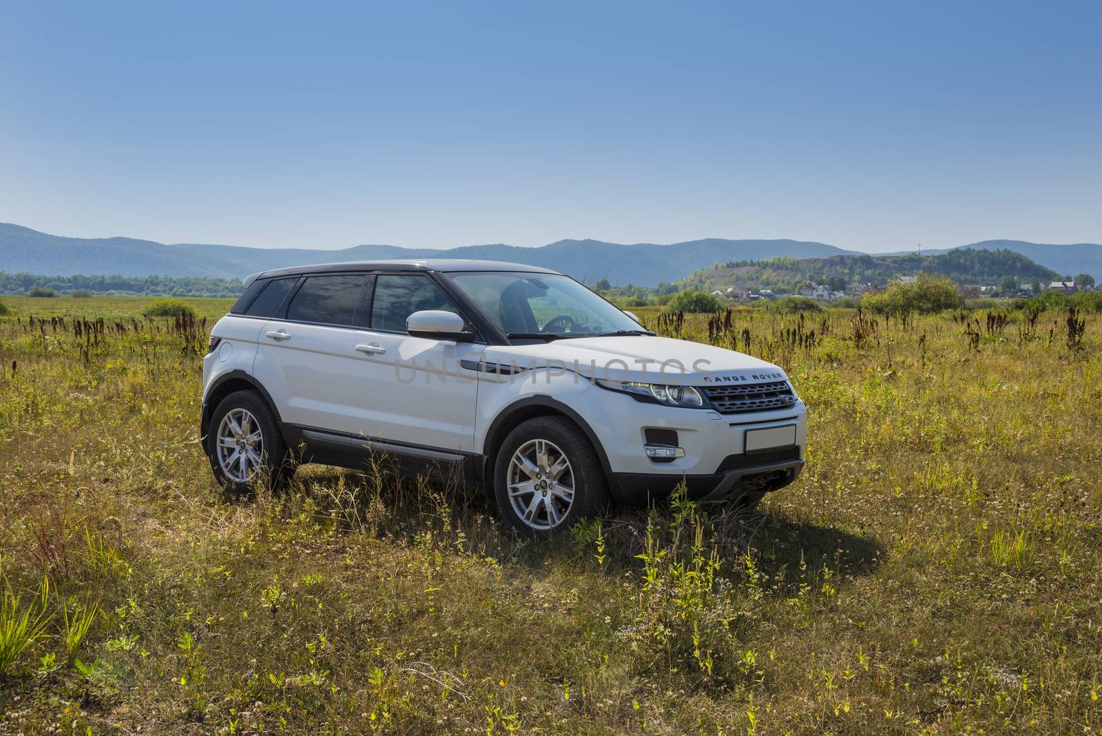 Car Land Rover Range Rover is in the field on a Sunny autumn day near the city of Samara, Russia. August 1, 2018.