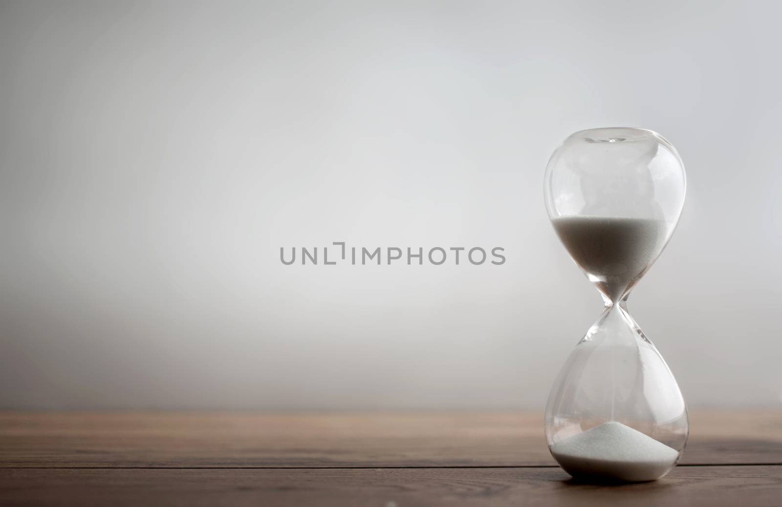 Sand flowing through hourglass 