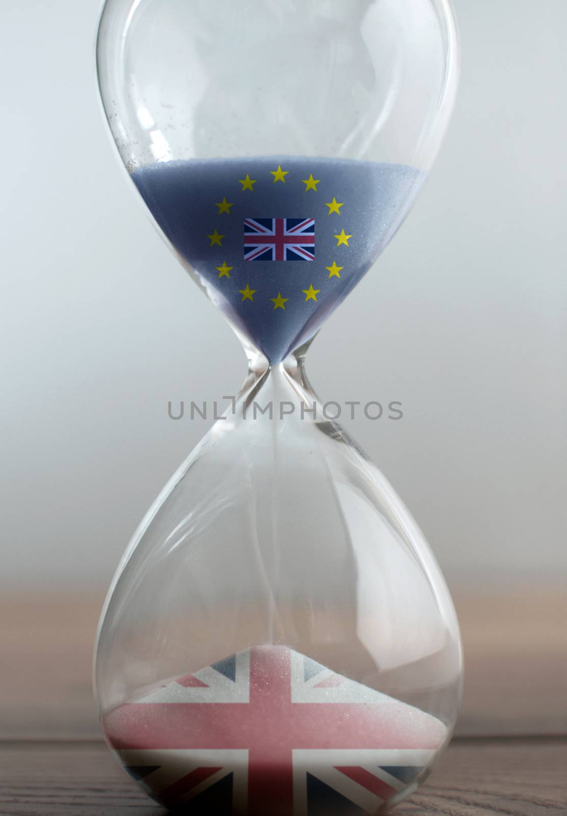 Euro sand with british flag transitioning into british flag