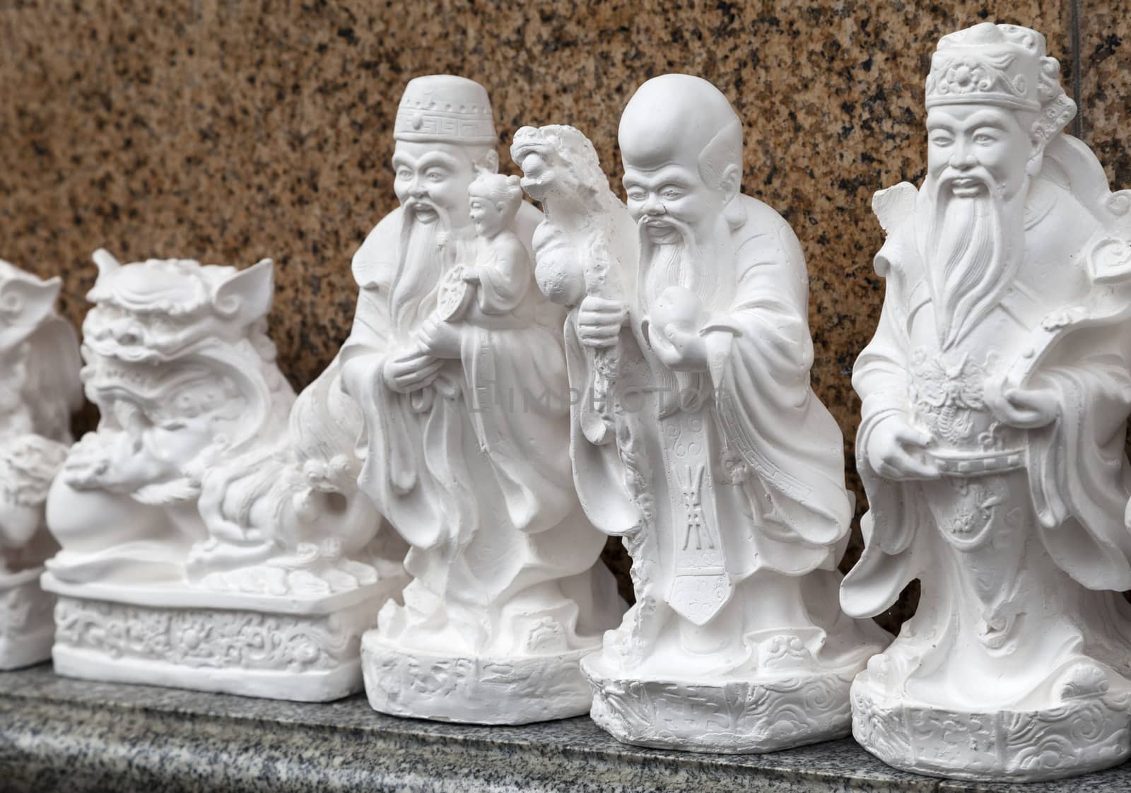 SAIGON, VIETNAM - JANUARY 04, 2015 - Plaster statuettes representing Buddhist deities