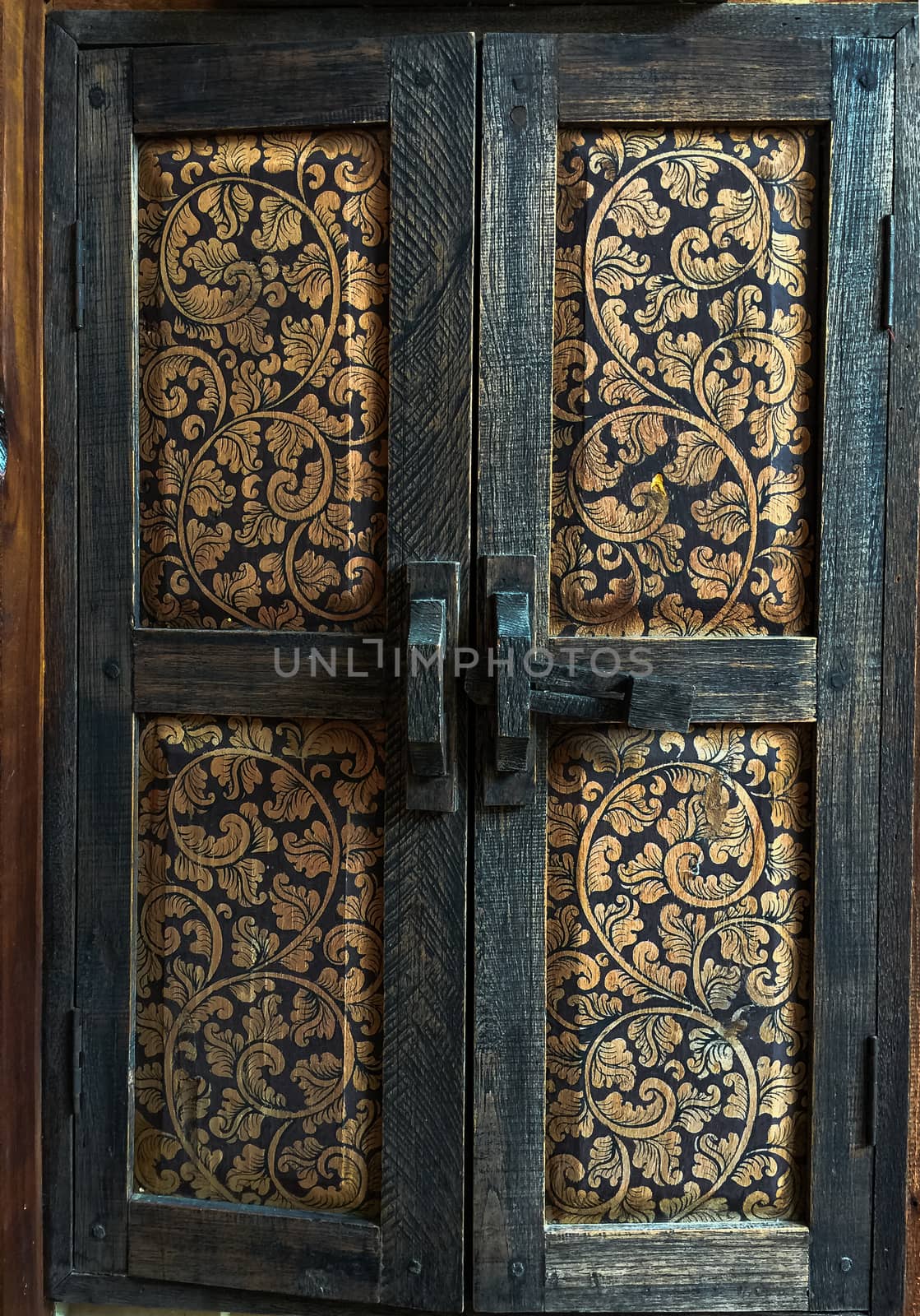 A old wood windows. Beautiful art paint on wood Thai stye craftsmanship