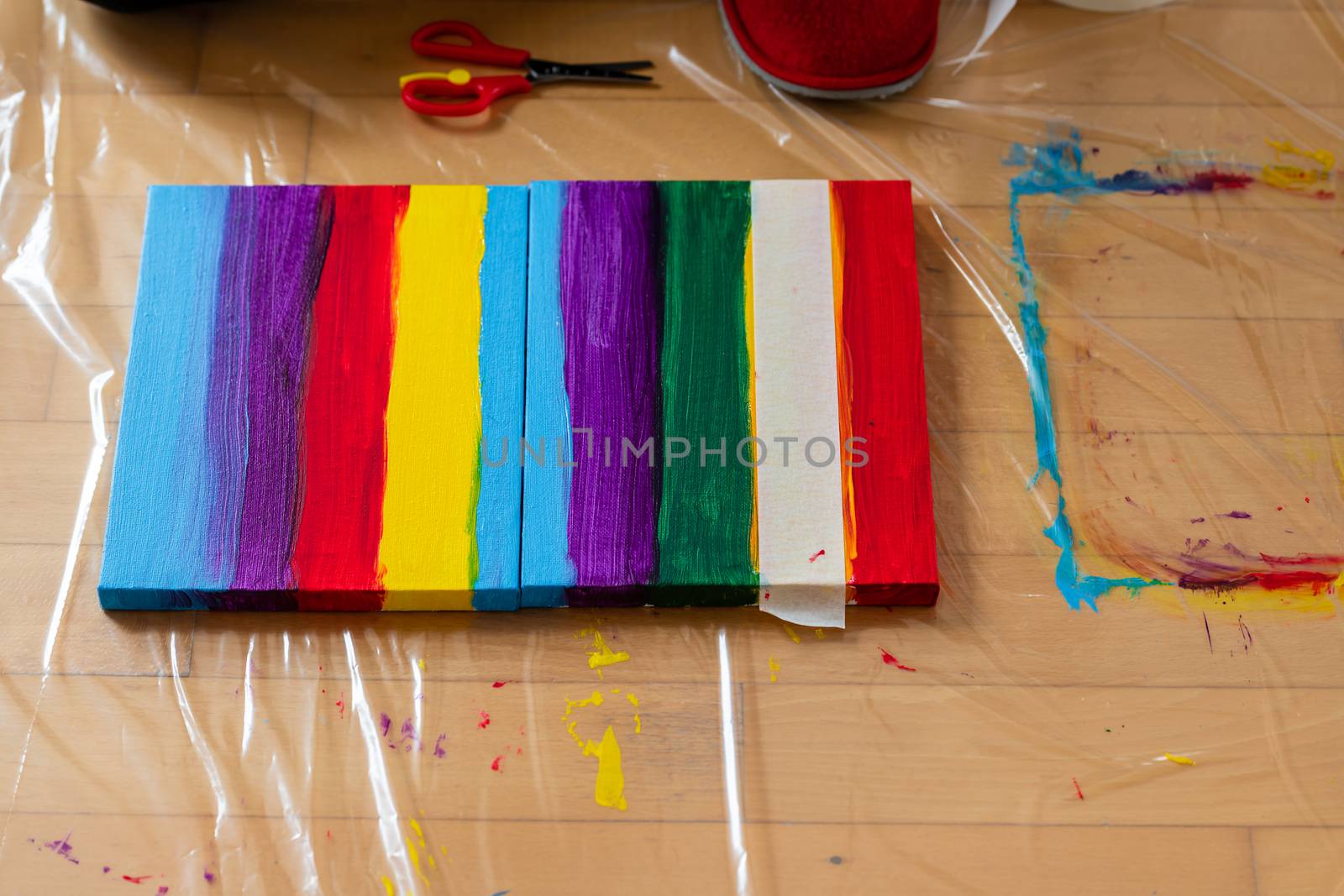 Painting rainbow on canvas, gay pride, transsexuality concept by asafaric