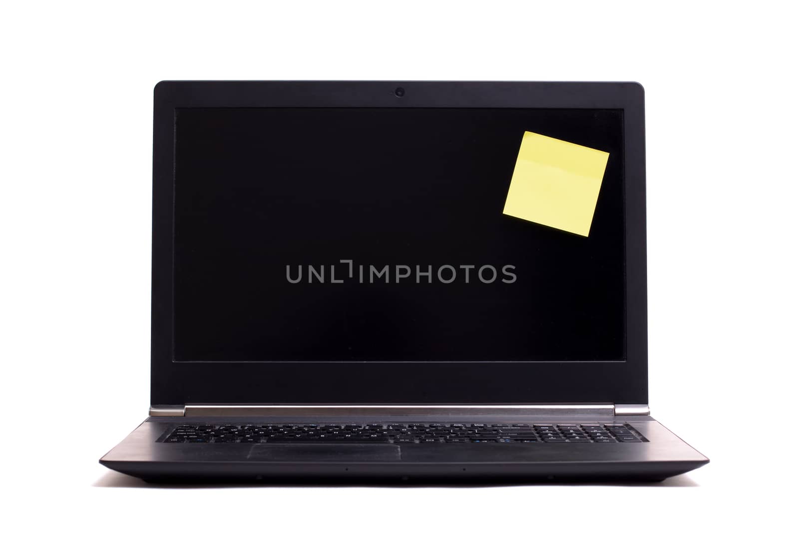 Empty blank post it note on a black laptop by michaklootwijk