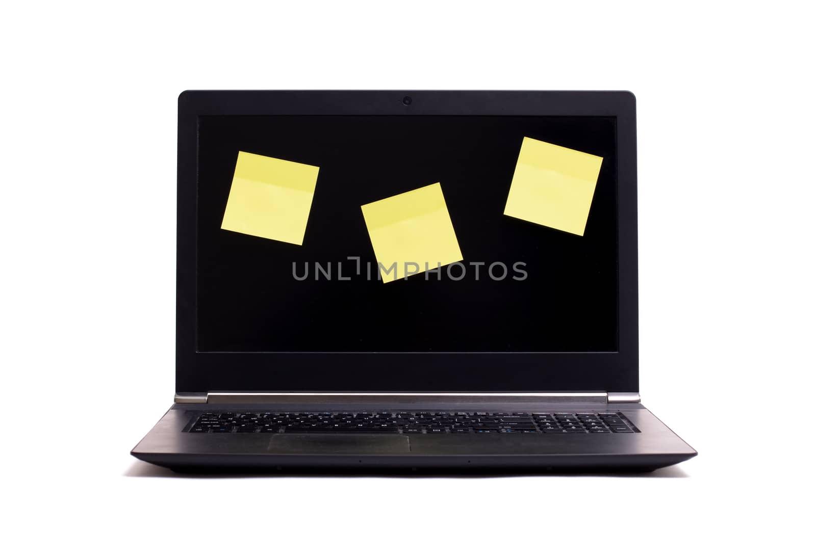 Empty blank post it notes on a black laptop, isolated