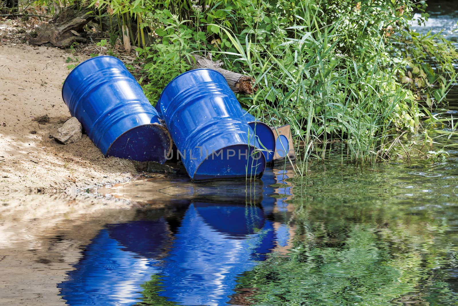 dumped blue oil drums cause pollution in the water, more and more the water is polluted by throwing away waste which therefore gets into the rivers