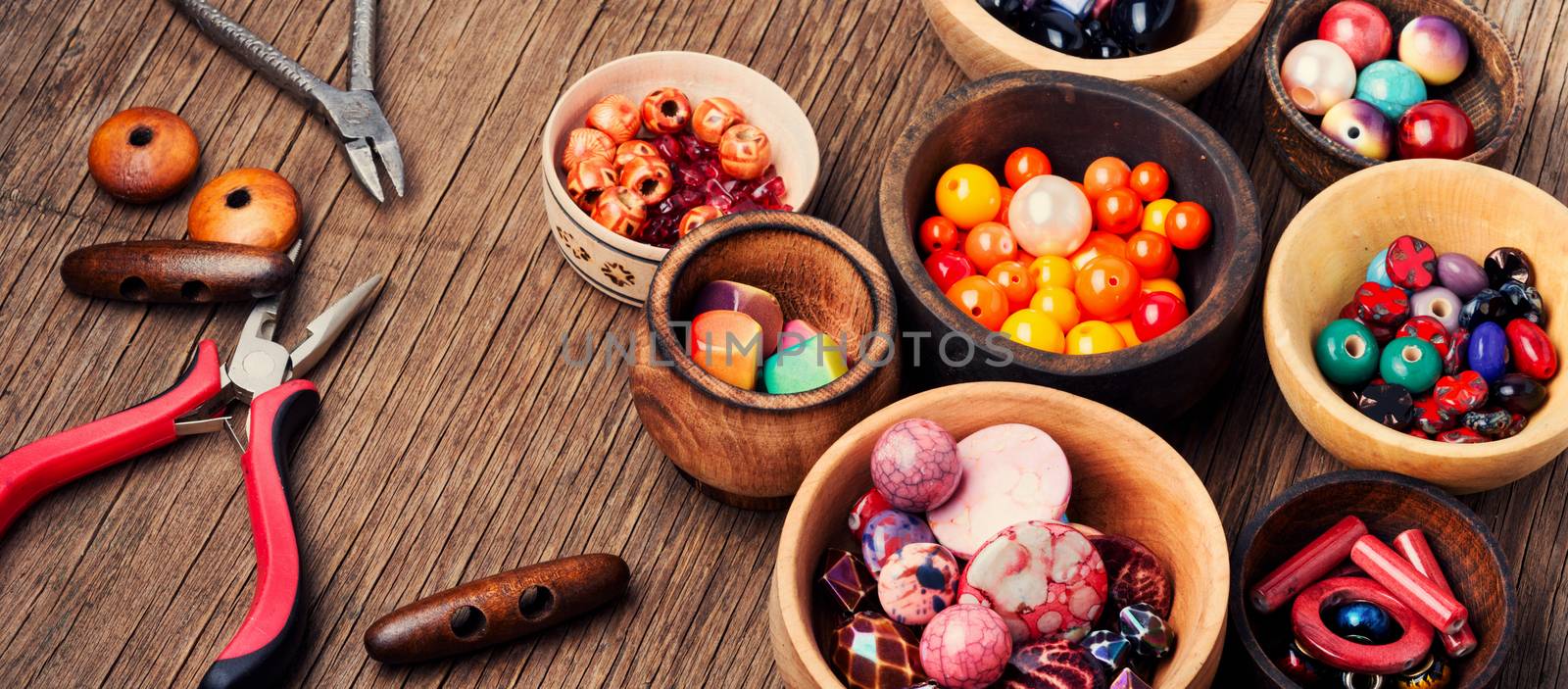 Fashion beads in wooden bowls by LMykola