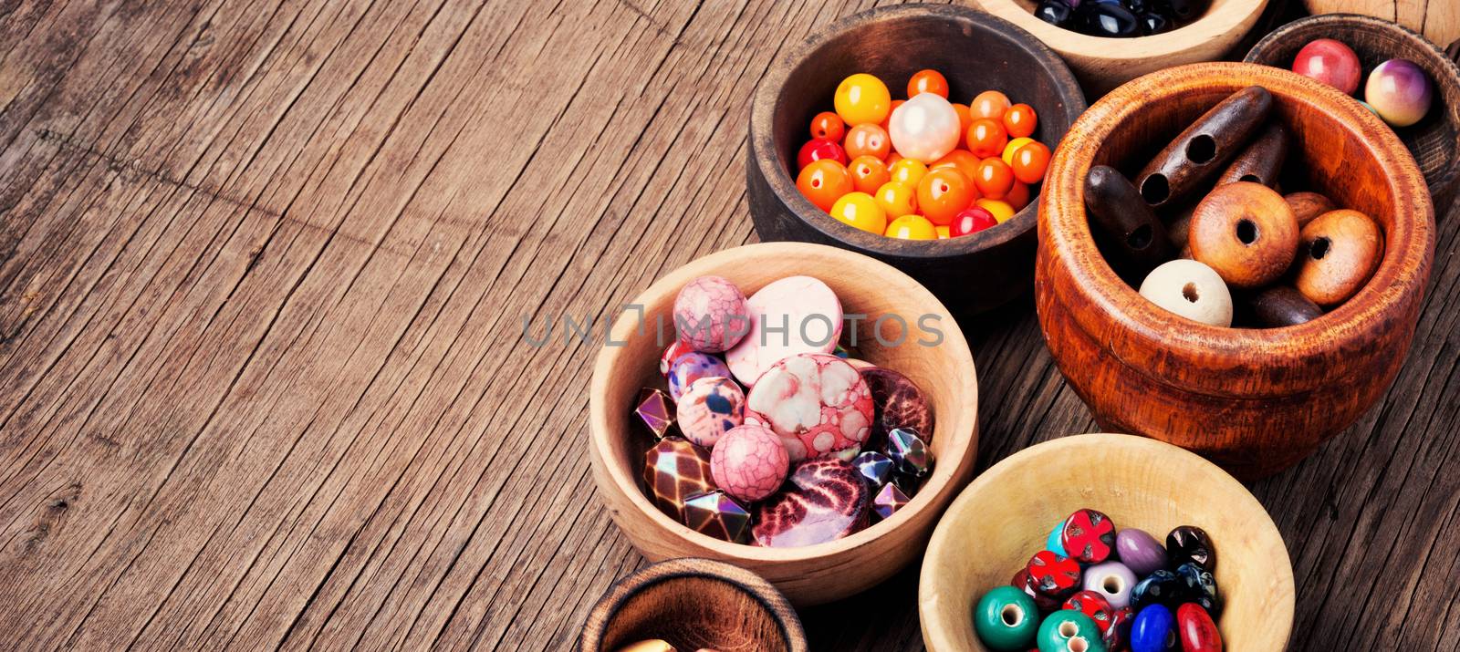 Fashion beads in wooden bowls by LMykola