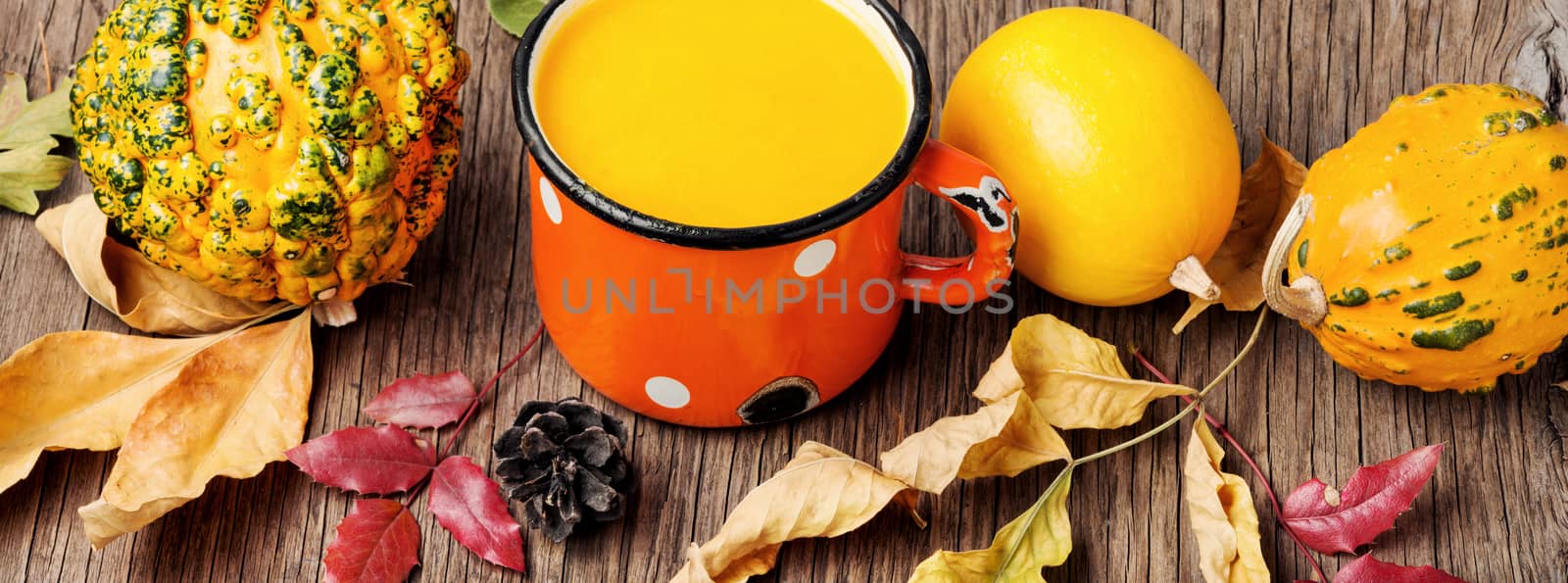 Pumpkin smoothie on rustic table by LMykola