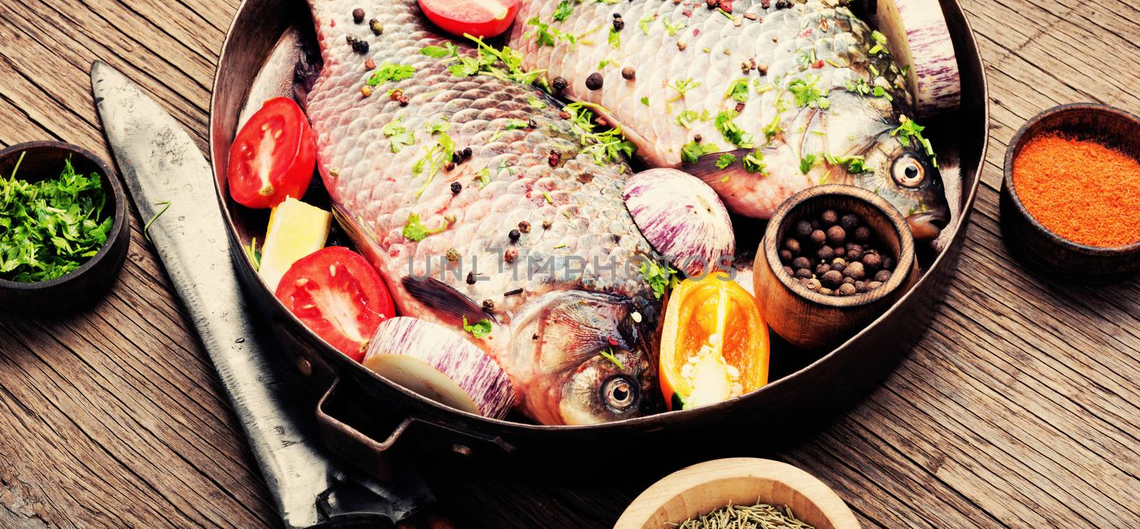 Fish with herbs, spices and vegetables - healthy food.Dietary food
