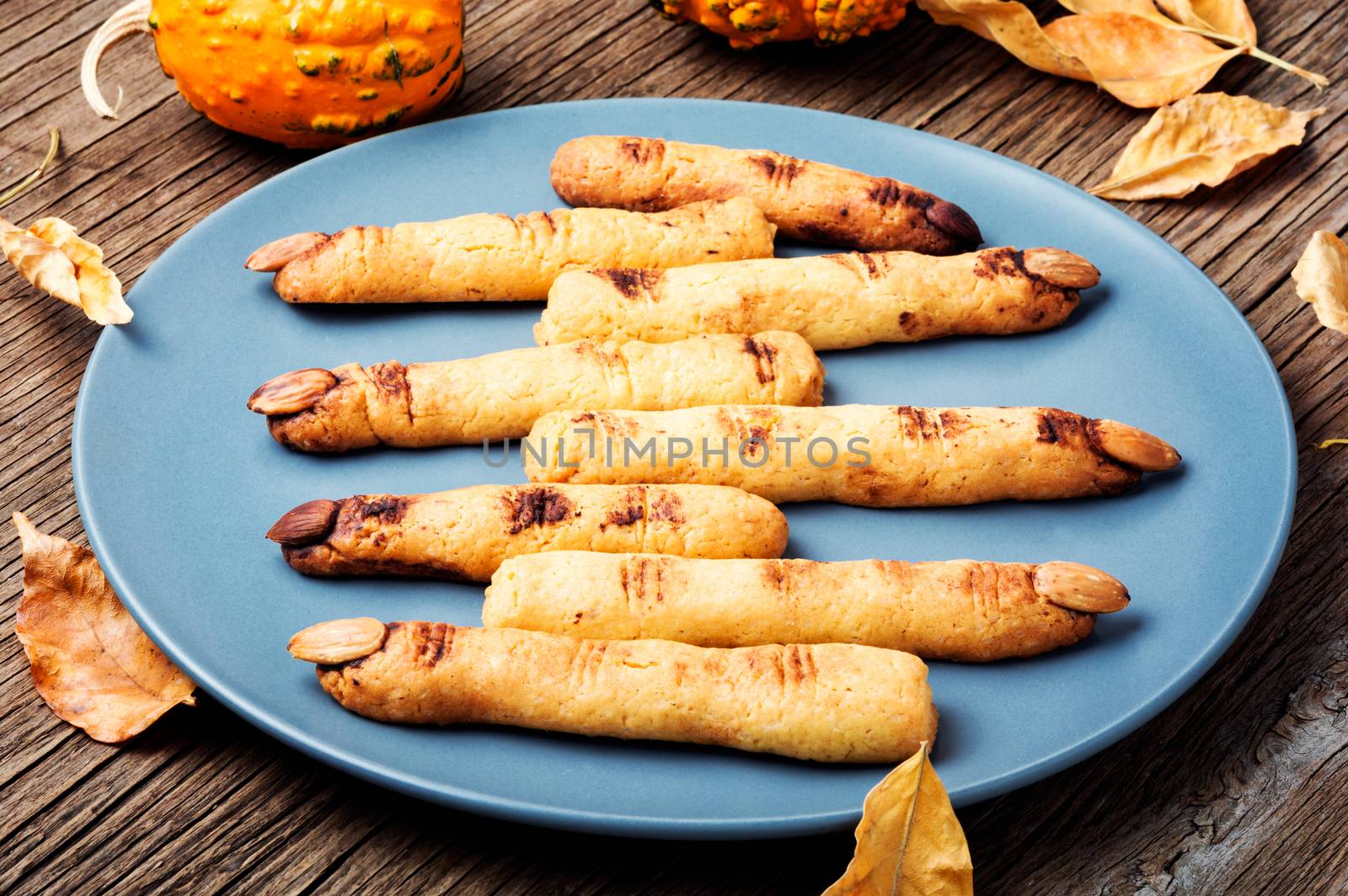 Halloween finger cookies on wooden table. Halloween party.
