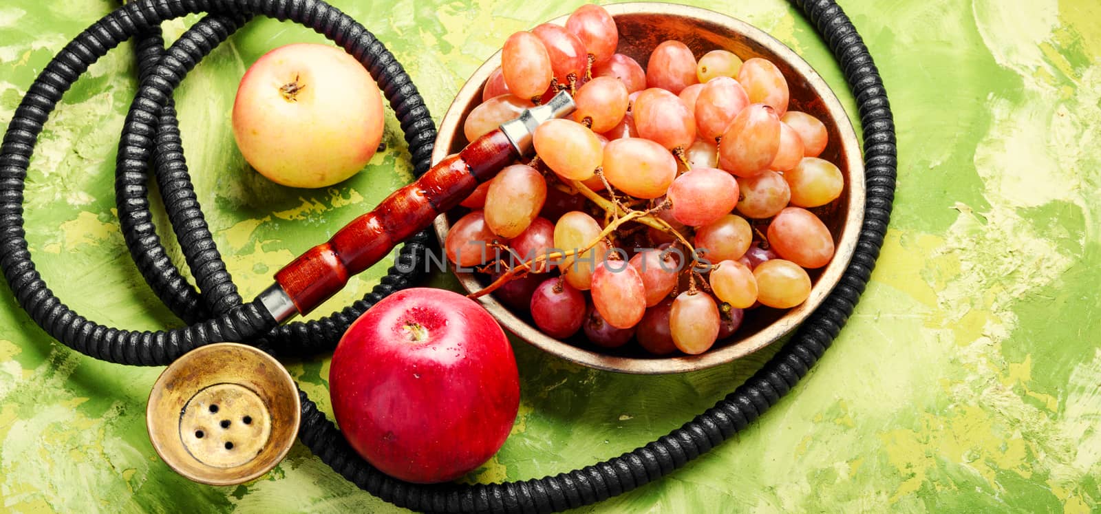 Turkish smoking hookah with taste of a fruit mixture of grapes and apples.Shisha concept. Fruit taste of hookah.