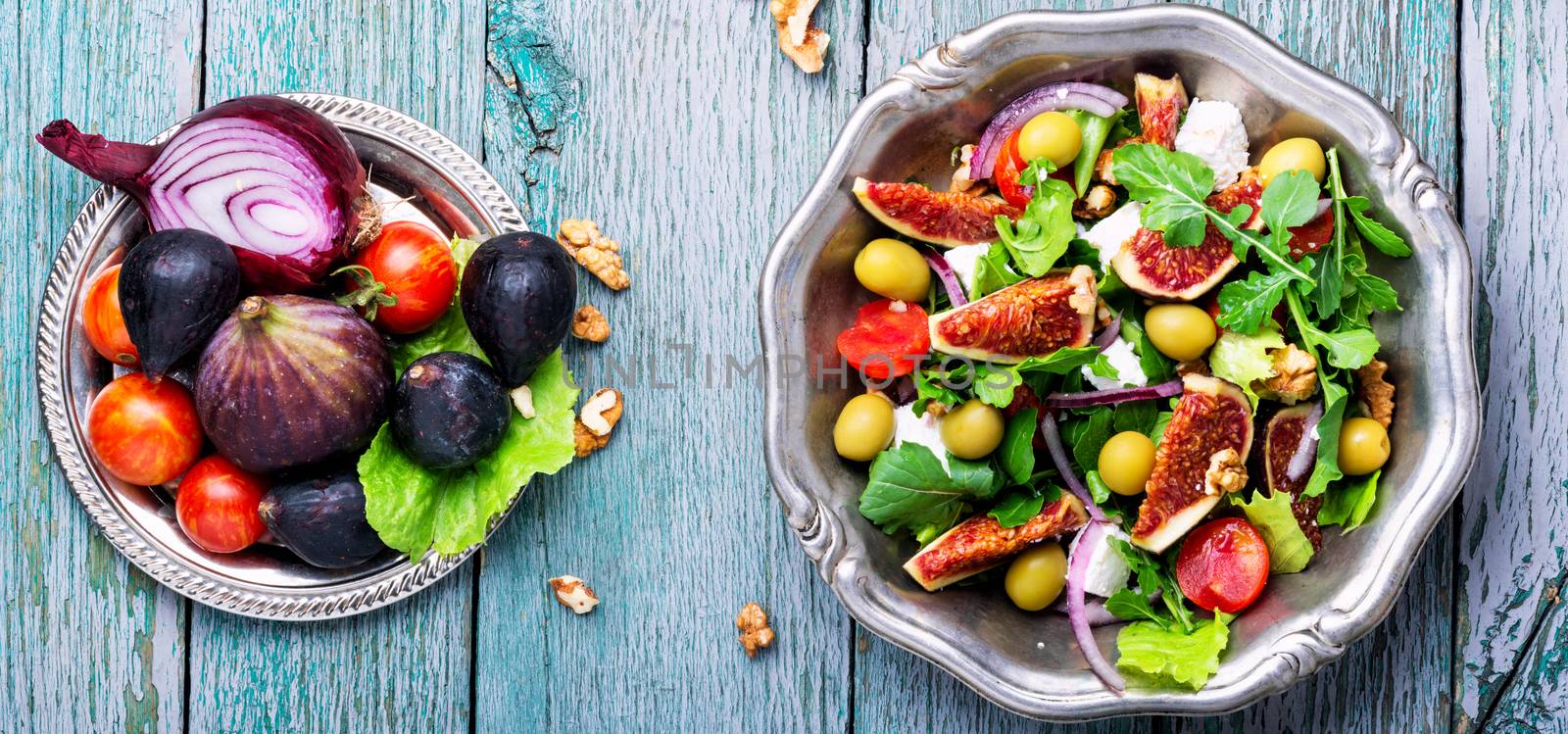 Autumn salad with arugula,olive, figs and cheese.Healthy food